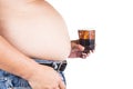 Obese man with big belly holding a glass of fizzy soda Royalty Free Stock Photo
