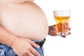 Obese man with big belly holding a glass of refreshing cold beer Royalty Free Stock Photo