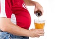 Obese man with big belly pouring a glass of refreshing beer Royalty Free Stock Photo