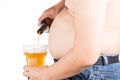 Obese man with big belly pouring a glass of refreshing beer Royalty Free Stock Photo