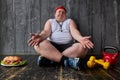 Obese man can not decide whether to train or eat