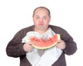 Obese man eating watermelon