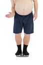 Obese man has fun on scales Royalty Free Stock Photo