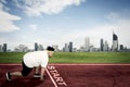 Obese man kneeling on the start line Royalty Free Stock Photo
