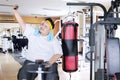 Obese man takes picture on an exercise bike Royalty Free Stock Photo