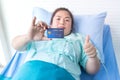 Obese patients asian women in bed hospitals holding credit cards