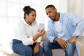 Obese hispanic woman showing phone to her boyfriend Royalty Free Stock Photo