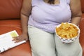 Obese Woman With A Bowl Of Nachos Royalty Free Stock Photo