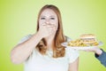 Obese woman closed mouth for fast food Royalty Free Stock Photo