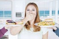 Obese woman closed mouth for unhealthy food Royalty Free Stock Photo