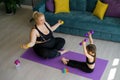 Obese Woman with the daughter Doing sports with dumbbells at home Royalty Free Stock Photo