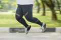 Obese woman feet running on the road Royalty Free Stock Photo