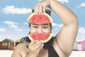 Obese woman with fresh watermelon Royalty Free Stock Photo