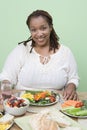 An Obese Woman Holding Glass Of Water