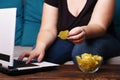 Obese woman with laptop, junk food and beer Royalty Free Stock Photo