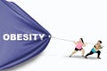 Obese women pull Obesity word Royalty Free Stock Photo