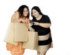 Obese women with smartphone and shopping bags