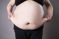 Obesity female body, fat woman belly close up Royalty Free Stock Photo