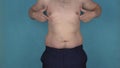 Fat folds and overweight on torso, breast and belly shaking in slow motion. Obesity, graceless body. Plump or thick guy