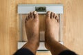 Obesity And Weightloss. Feet On Weight Scale