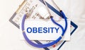 Obesity Word on a white sheet of paper, medical concept