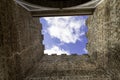 Obidos, Portugal: Point of view of the medieval castle of Obidos in Portugal. Low prospective of the castle tower against the blue Royalty Free Stock Photo