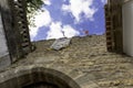 Obidos, Portugal: Point of view of the medieval castle of Obidos in Portugal. Low prospective of the castle tower against the blue Royalty Free Stock Photo