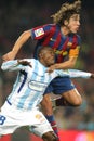 Obinna of Malaga and Puyol of Barcelona Royalty Free Stock Photo