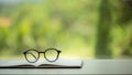 Object education green nature background with stack of ancient books or old bible, open paper book on wooden table with copy space Royalty Free Stock Photo