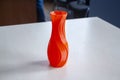 Object form vase of red color printed on a 3D printer. Three-dimensional model