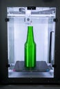 Object green bottle printed on 3D printer close-up, inside on 3d printer. Royalty Free Stock Photo