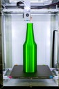Object green bottle printed on 3D printer close-up, inside on 3d printer. Royalty Free Stock Photo