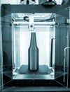 Object green gray bottle printed on 3D printer close-up, inside on 3d printer. Royalty Free Stock Photo