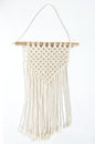 Object, macrame cotton on white background. Decorative handmade hobby interior for hanging on wall . DIY and hobby concept