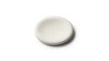 Object resembling a soft flat pebble appears against a plain white Royalty Free Stock Photo