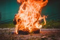 Worn motorcycle boots burning Royalty Free Stock Photo