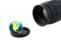 Objective and globe on lens cup Royalty Free Stock Photo