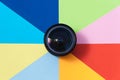 Objective lens of photo camera on multicilored background Royalty Free Stock Photo