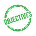 OBJECTIVES text written on green grungy round stamp