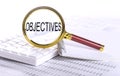 OBJECTIVES word through magnifying glass on keyboard on the chart