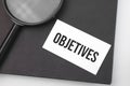 Objectives word on paper and magnifying lens