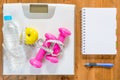 Objects for weight loss and a notebook for recording the results