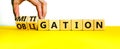 Obligation and mitigation symbol. Businessman turns wooden cubes changes the concept word obligation to mitigation. Beautiful