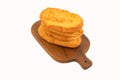Toasted Bread Rusks on wooden cutting bord isolated on white Royalty Free Stock Photo