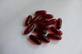 Oblong red capsules of krill oil