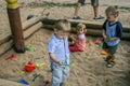 2010.08.15, Obninsk, Russia. Group of children playing on the sand playground.