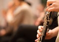 Oboe player performing in an orchestra