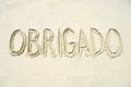 Obrigado Thank You Message in Sand Royalty Free Stock Photo