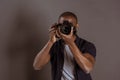 obscured view of african american photographer taking picture