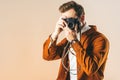 obscured view of fashionable man taking picture on photo camera Royalty Free Stock Photo